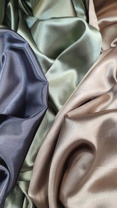 three different colors of satin fabric