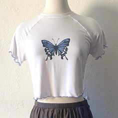 "Urban Outfitters 90s 00s vibe crop tee with sparkly butterfly print and contrast light blue lettuce hem. Stretchy rayon spandex jersey Tagged large but would fit smaller sizes too, cute loose. Bust 35-48\" comfortably (very stretchy), length 17.5\"" Sparkly Butterfly, Diy Crop Top, Small Mannequin, Contrast Lighting, Mesh Tank Top, Mesh Shirt, Lettuce Hem, Wool Vest, Little Outfits