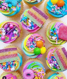 cupcakes decorated with rainbow icing and sprinkles