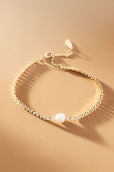 The Single Pearl Bracelet offers timeless elegance with its understated simplicity, adding a touch of sophistication to any ensemble. | Single Pearl Bracelet by Anthropologie in Gold, Women's, Gold/Plated Brass/Freshwater Pearl Wedding Bracelets For Bride, Gold And Pearl Bracelet, Jewelry For Bridesmaids, Bridal Things, Bridesmaid Pearl Bracelet, Pearl Bracelet Jewelry, Pearl Bracelet Gold, Pearl Veil, Gold Pearl Bracelet