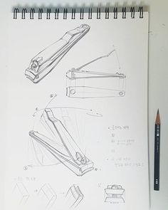 a drawing of some kind of device on top of a white paper next to a pencil