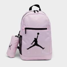 This Air Jordan Backpack In Pink Foam And Black Is Perfect For School Or Sports. With A Size Of 18 In X 12 In X 5 In, It Has Plenty Of Room For Your Belongings And Features Inner Dividers, Inner And Outer Pockets, And A Bottle Pocket. The Adjustable Straps And Top Handle Provide Comfort And Convenience, While The Solid Pattern And Jordan Character Family Make It A Stylish Accessory. This Backpack Is Made Of Polyester And Has A Fabric Lining, With A Zippered Closure And Accents. It Is Brand New W Sporty Pink Backpack For School, Sporty Pink School Backpack, Functional Pink Sports Backpack, Pink Backpack For Outdoor Activities, Sporty Pink Backpack For Sports, Functional Pink Backpack, Pink Standard Backpack For Sports, Pink Sports Backpack, Pink Sporty Standard Backpack