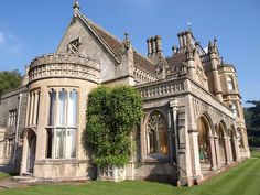 an old stone building with ivy growing on it