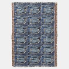 a blue denim wall hanging on the side of a white wall