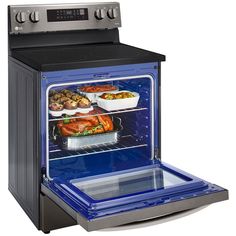 an oven with the door open and food in it's bottom shelf, on display