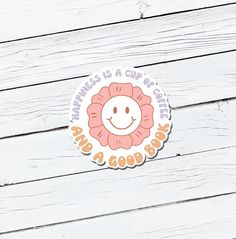 a sticker that says happiness is a cup of coffee with a smiling face on it