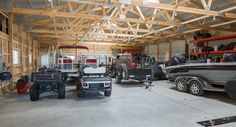 a garage filled with lots of different types of boats and vehicles in it's storage area