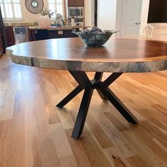 a wooden table sitting on top of a hard wood floor