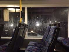 the seats are covered in rain on the bus