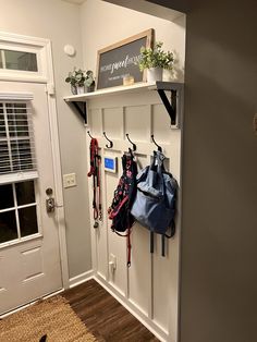 the entryway is clean and ready to be used as a storage area for purses