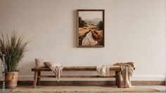 a painting hanging on the wall above a wooden bench