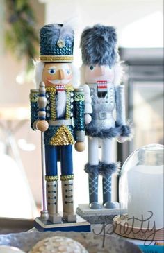 two nutcrackers are standing next to each other