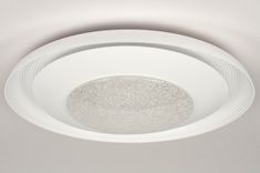 a white ceiling light that is on the ceiling