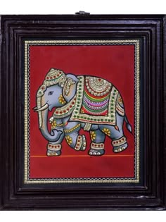 an elephant painted on the side of a red wall with gold trimmings and designs