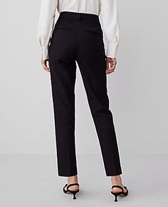 Elevate your wardrobe with the Ann Taylor High Rise Eva Ankle Pant, a piece that redefines elegance with its sleek silhouette. These pants are designed to flatter with a high rise that sits just below the natural waist and a slim leg that gracefully crops at the ankle. Perfect for both office and casual wear, these versatile pants are a must-have in every fashion-forward woman's collection.

- **Size**: 4 Regular
- **Color**: Black
- **Material**: 92% Cotton, 8% Spandex
- **Gender**: Female
- ** Mid-rise Tapered Pants For Workwear, Tapered Mid-rise Work Pants, Mid-rise Tapered Work Pants, Fitted Cropped Leg Office Pants, Fitted Cropped Pants For Office, Fitted Cropped Office Pants, Fitted Black Ankle-length Pants, Black Tapered Ankle-length Pants, Black Ankle-length Dress Pants With Pressed Crease