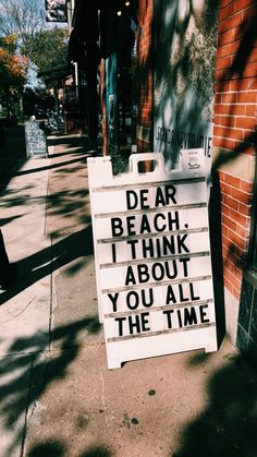 a sign that says dear beach i think about you all the time