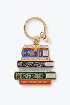 a stack of books with a keychain that says pride, perfudge, and whimzing heights