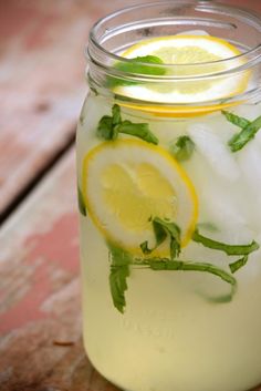 a mason jar filled with lemonade and mint