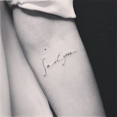 a woman's arm with a tattoo that reads, smile and love on it