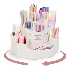 a white desk organizer filled with markers and pencils