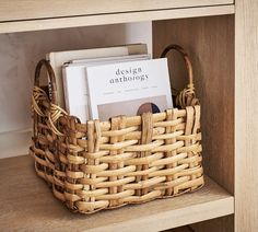 a wicker basket with books in it sitting on a shelf next to a bookcase