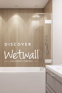 a white bath tub sitting next to a walk in shower under a sign that reads discovery wetwall