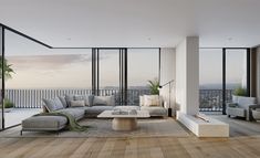 a living room filled with lots of furniture and large windows overlooking the cityscape