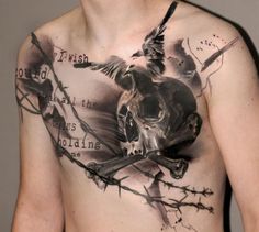 a man with tattoos on his chest has a bird and barbed wire around the chest