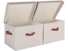 two canvas storage bins with leather handles, one open and the other closed on both sides