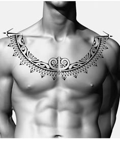 a black and white photo of a man's chest with an intricate design on it