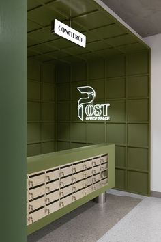 an empty file cabinet in the corner of a room with a sign that says cost