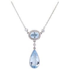 This aquamarine necklace whilst not of any great age has been crafted from quality stones and entirely set in platinum and 18 karat white gold. The necklace centres on two aquamarines, one oval cut, the other pear cut, each a medium light blue with slight inclusions. The aquamarines are accented with round brilliant cut diamonds which are each of G/H colour and VS-SI1 clarity totalling 0.60 carat. The platinum pendant is connected to a fine platinum chain which terminates with an 18 karat white Platinum Jewelry Necklaces, Art Deco Pendant Necklace, Platinum Pendant, Art Nouveau Necklaces, Fan Necklace, Platinum Chain, Art Nouveau Pendant, Bolt Ring, Pearl And Diamond Necklace