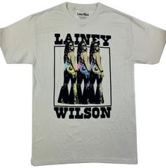 Show your country spirit with this Lainey Wilson T-Shirt. The colorful graphic printed on the front will lasso attention. The cotton fabrication ensures comfort all day long. Complete with a classic crew neckline and short sleeves, it's the perfect choice for fans of Lainey Wilson's music. 100% Cotton Machine Washable Short Sleeve Crew Neck Graphic T-Shirt White Graphic Tee For Country Concerts, Lainey Wilson Shirt Ideas, Laney Wilson Hats, Lainey Wilson Sublimation, Lainey Wilson Tshirt, Cotton Band Merch T-shirt For Country Concerts, Cotton Graphic Print T-shirt For Country Concerts, Graphic Print Crew Neck T-shirt For Country Concerts, Lainey Wilson