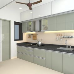 a modern kitchen with gray cabinets and black counter tops, along with a ceiling fan