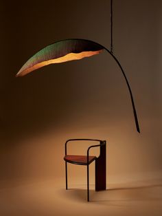 a lamp that is sitting next to a chair