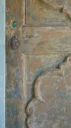 an old wooden door with carvings on it