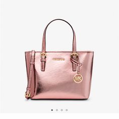 Michael Kors Jet Set Travel Extra-Small Metallic Top-Zip Tote Bag. Color: Primrose. Metallic, 55% Polyurethane, 35% Polyester, 10% Lurex. Gold-Tone Hardware. 10.75’’W X 7.5 H X 4’’ D. Handle-Drop 5’’. From Slip Pocket, Back-Zip Pocket. Lining 100% Polyester. Zip Fastening, Polish Charm Accent, Care It Crossbody. Duster Included. Mk Purse, Michael Kors Tote Bags, Michael Kors Crossbody Bag, Travel Tote Bag, White Tote, Zip Tote, Satchel Tote, Purses Michael Kors, Kors Jet Set