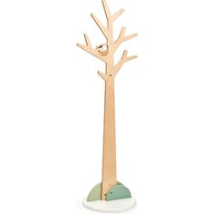 a wooden tree on top of a white base