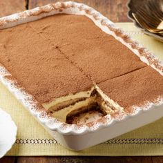 a cake that has been cut in half and is on a table with silverware