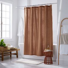 a bath room with a tub and a shower curtain