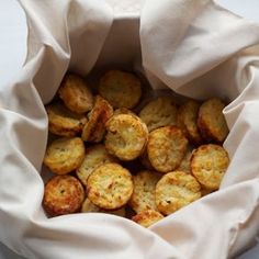 a bag full of cheesy cauliflower biscuits with the title 25 calorie