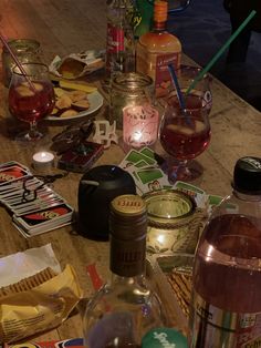 a table topped with lots of bottles of alcohol