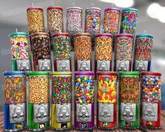 a bunch of different types of candy in tins