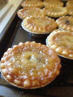 several pies sitting on top of an oven rack