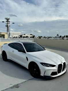 a white sports car parked on the street