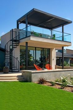 a modern house with an outdoor patio and stairs