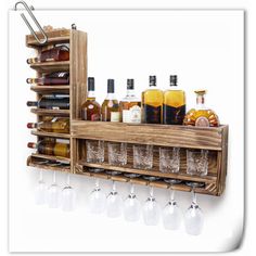 a wooden shelf with wine glasses and liquor bottles on the bottom, hanging from it's side