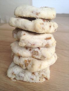 a stack of cookies sitting on top of a wooden table