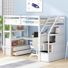 a white loft bed with desk underneath it and drawers below the bed, in a room with light blue walls