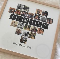 a family photo collage is displayed in a wooden frame on a white lace tablecloth